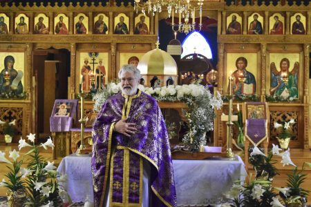 Father David Wey serving inside Saints Constantine & Elena